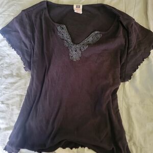 black v neck with lettuce trim and lace detailing